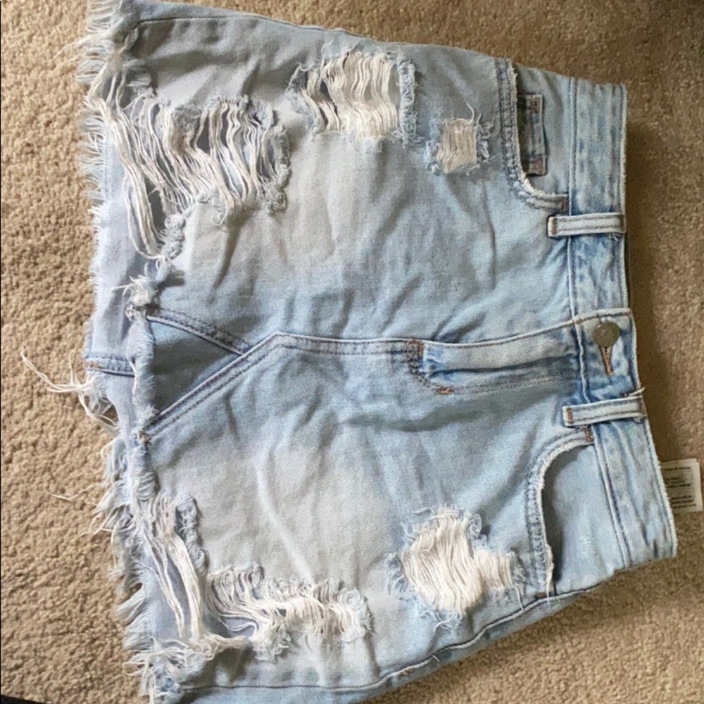 Ripped jean skirt.